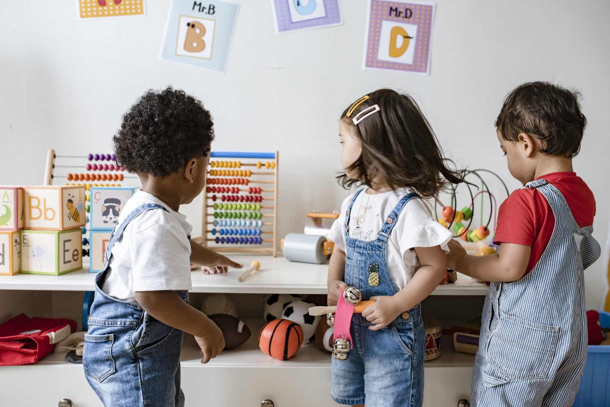 Toddlers exploring a Kid's Country classroom together